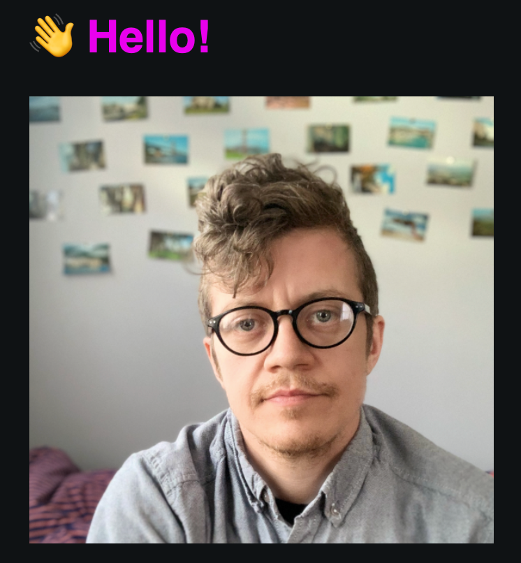 Portrait of the site creator, who has brown wavy hair and glasses.